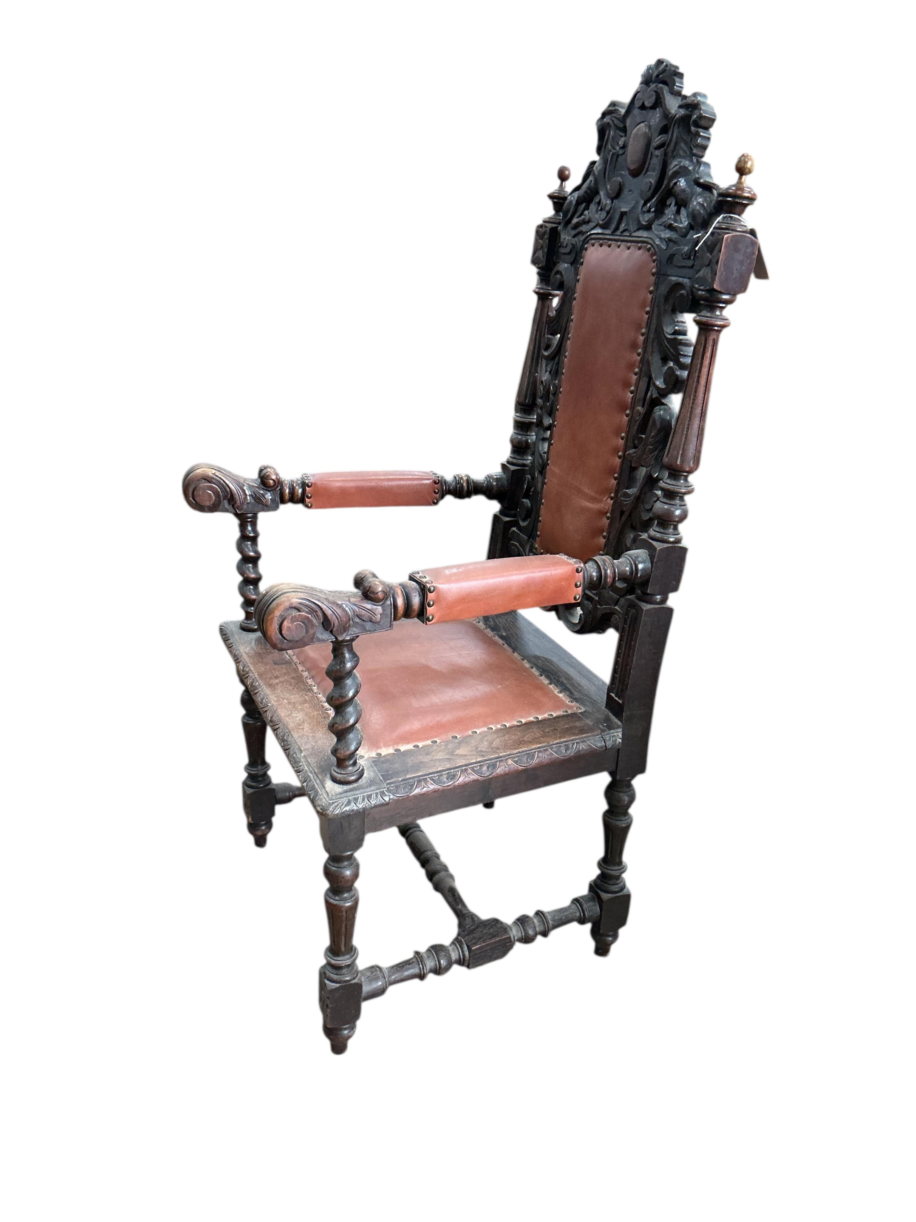 A late Victorian carved oak elbow chair, width 64cm, depth 62cm, height 136cm